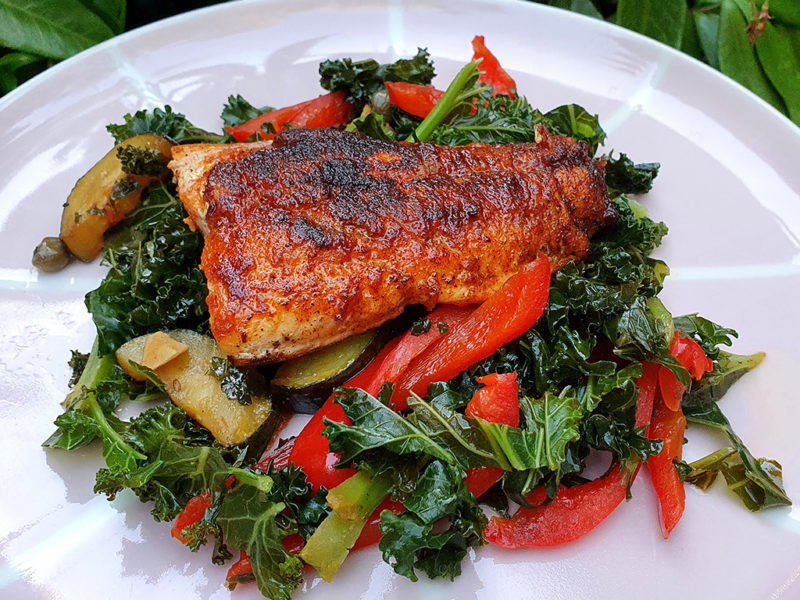 Salmon with sautéed kale and courgette