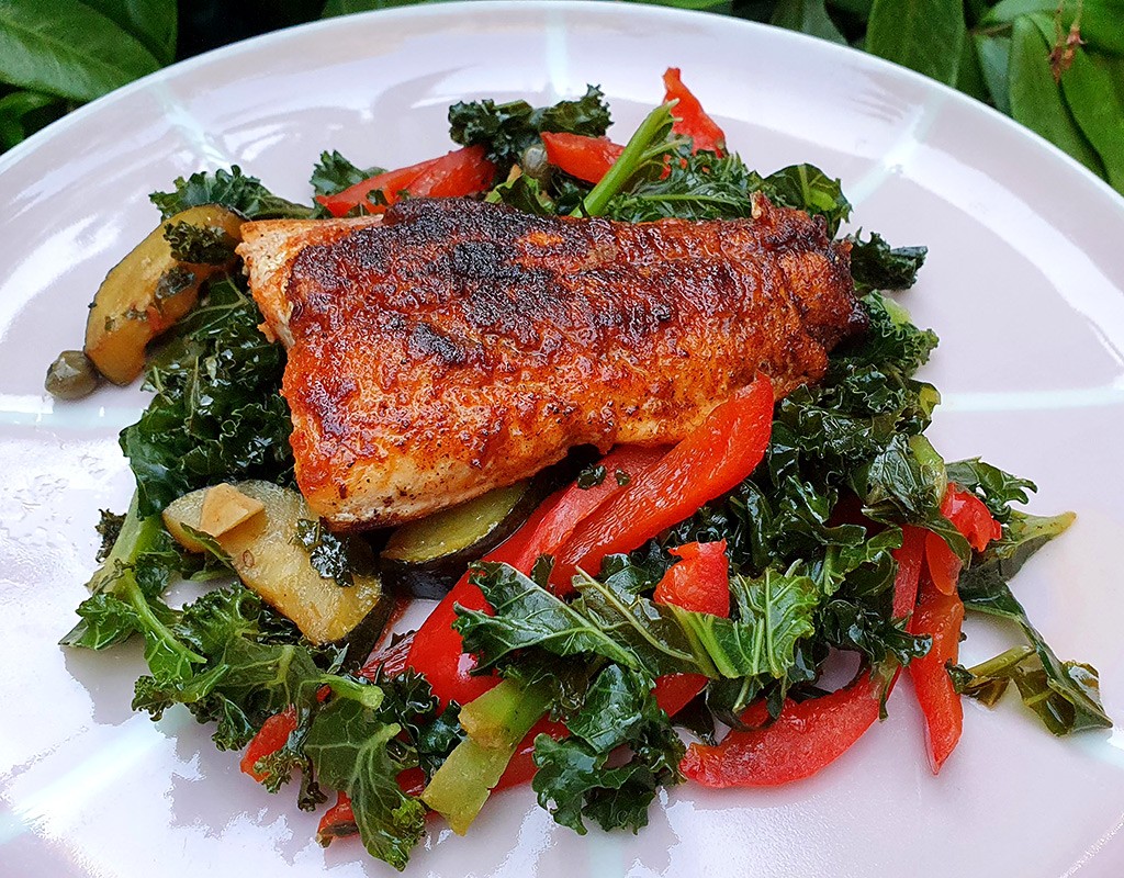 Salmon with sautéed kale and courgette