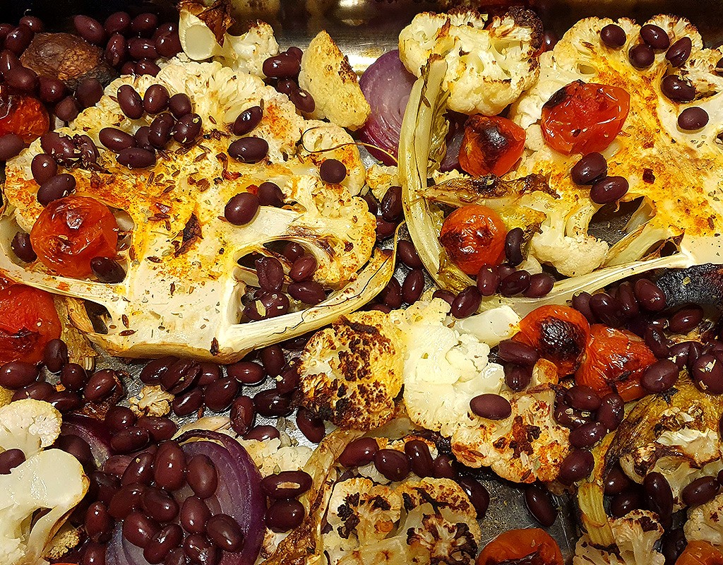 Baked cauliflower steaks with beans