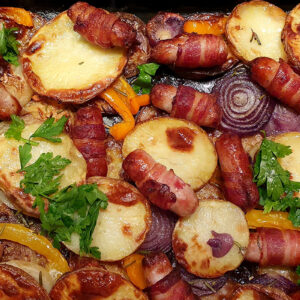 Potato bake with pigs in blankets