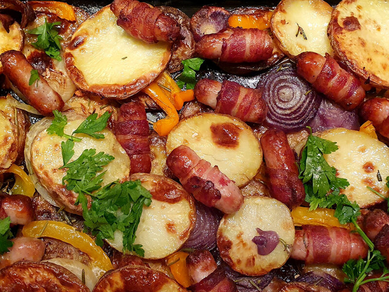 Potato bake with pigs in blankets