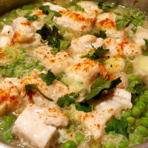 Potato and cod stew with green peas