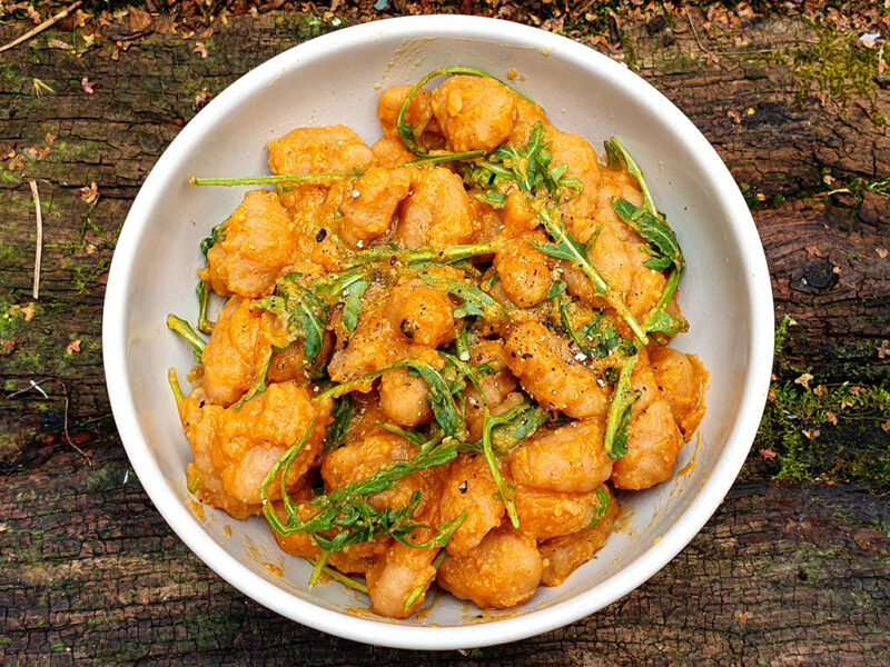 Gnocchi in spiced red lentil sauce