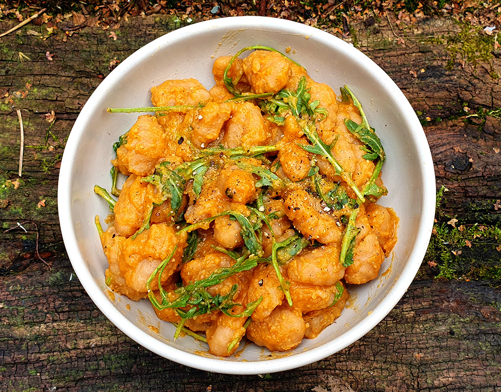 Gnocchi in spiced red lentil sauce