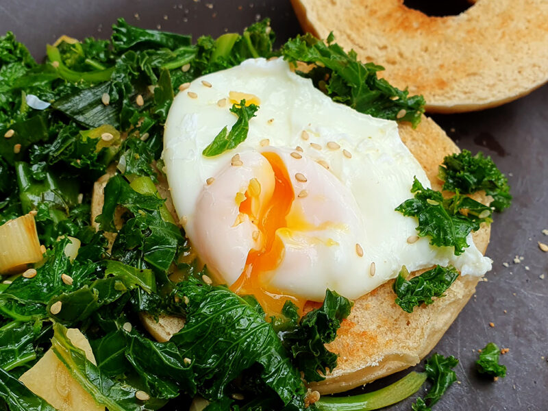 Bagel with poached egg and sesame kale