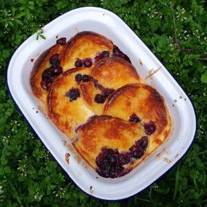 Brioche bread and butter pudding with blueberries