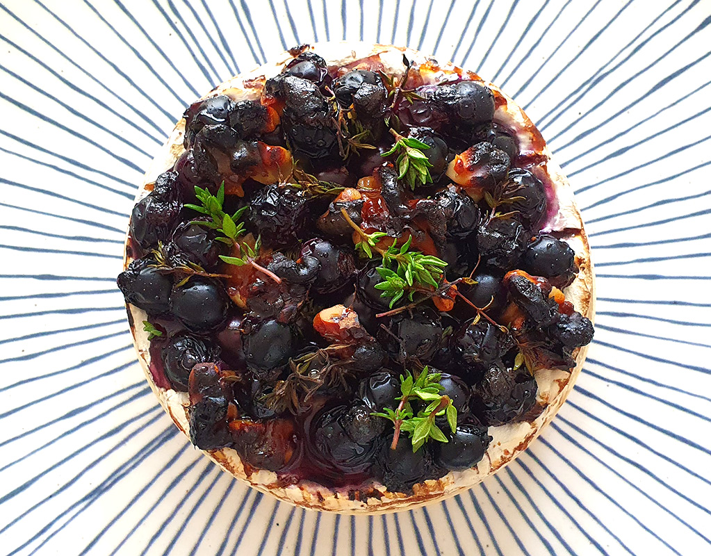 Camembert baked with blueberries