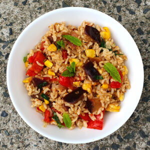 Spiced rice with aubergine and corn