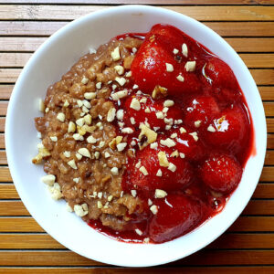 Chocolate porridge with stewed strawberries