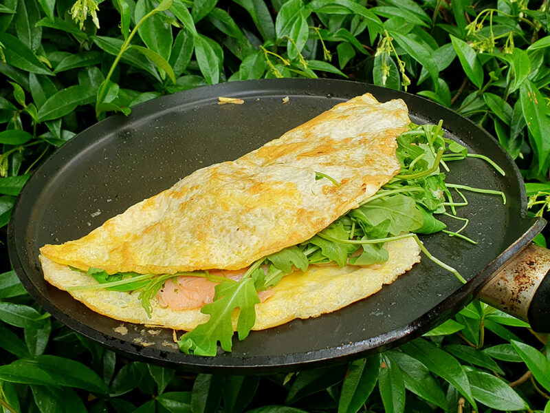 Smoked salmon omelette with spring onion and rocket