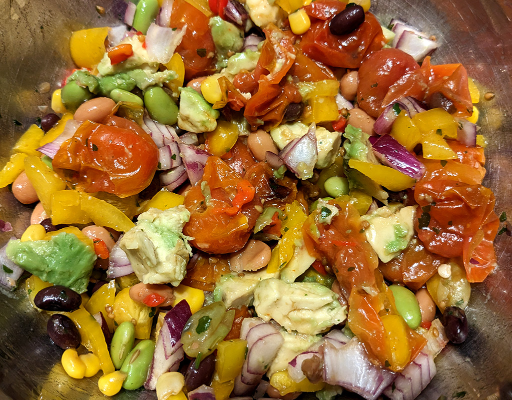 Grilled tomatoes, beans and avocado salad