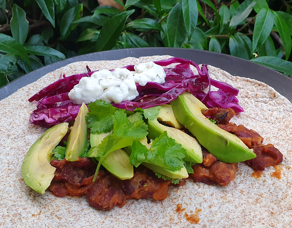 Chipotle bean and avocado tortilla wrap