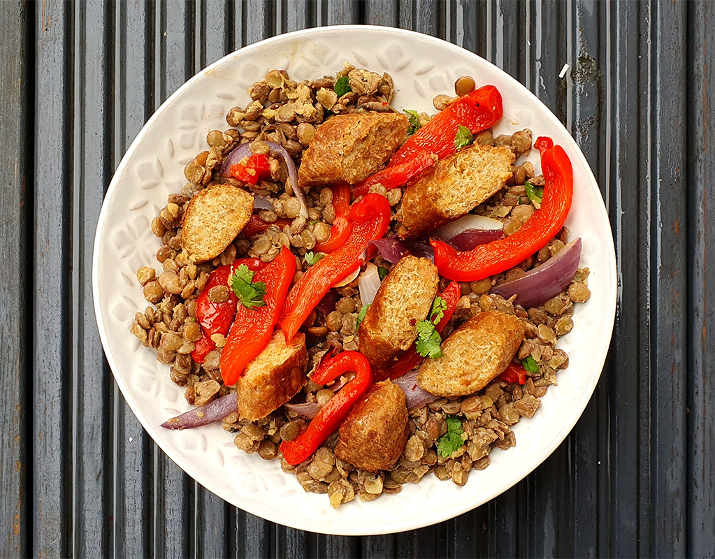 Lentils with roasted vegetables and sausages