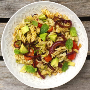 Avocado pesto pasta with caramelised onion