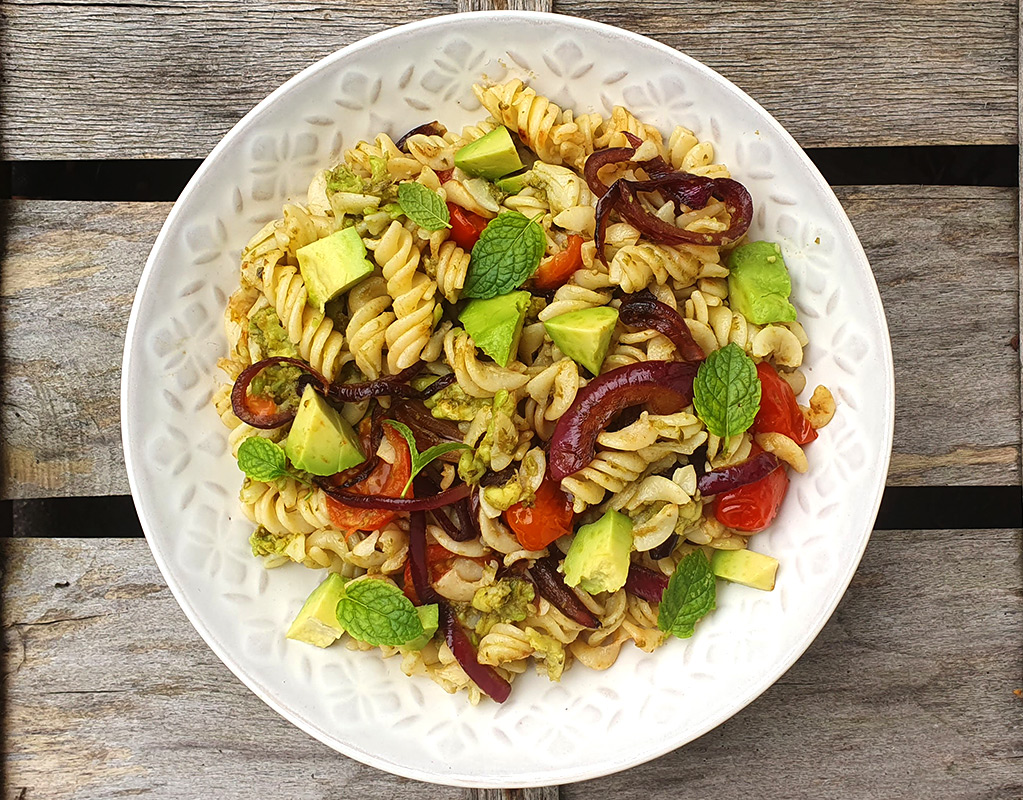 Avocado pesto pasta with caramelised onion