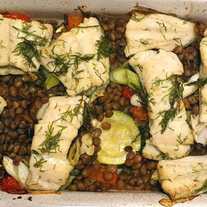 Baked cod with courgette and lentils