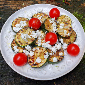 Grilled courgette with feta and tomato