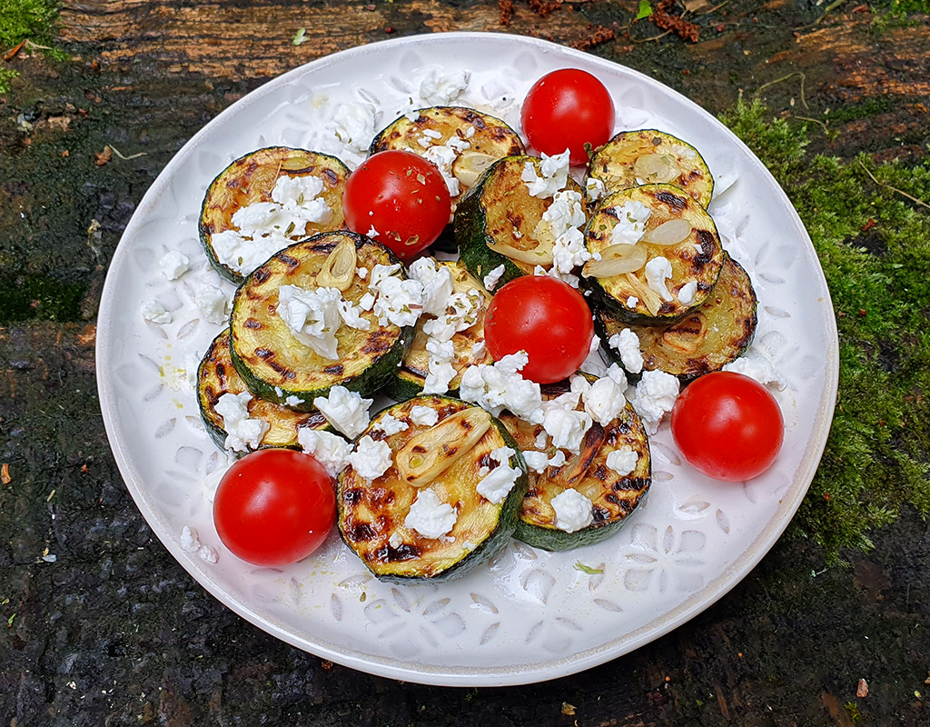 Grilled courgette with feta and tomato