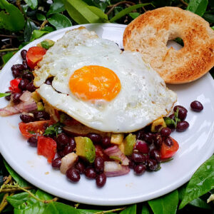 Bagel with egg and black beans salsa