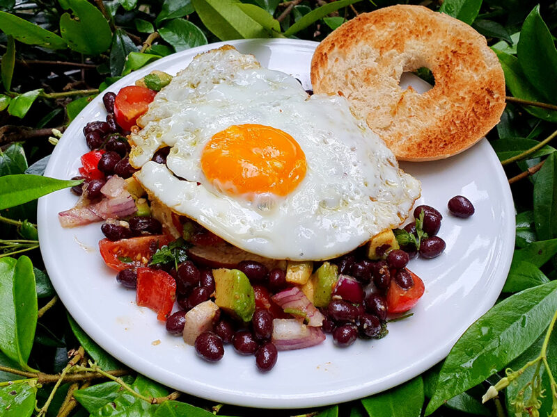 Bagel with egg and black beans salsa