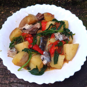 Potatoes with roasted vegetables and sardines