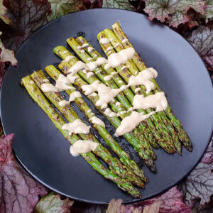 Grilled asparagus with zingy tahini sauce