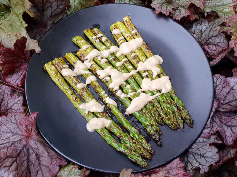 Grilled asparagus with zingy tahini sauce