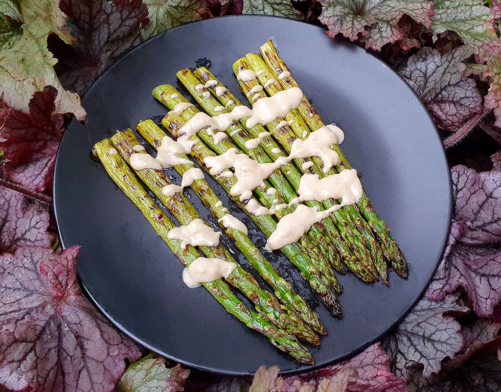 Grilled asparagus with zingy tahini sauce