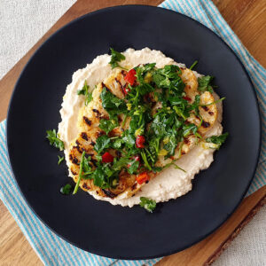 Cauliflower steak with bean hummus and chili gremolata