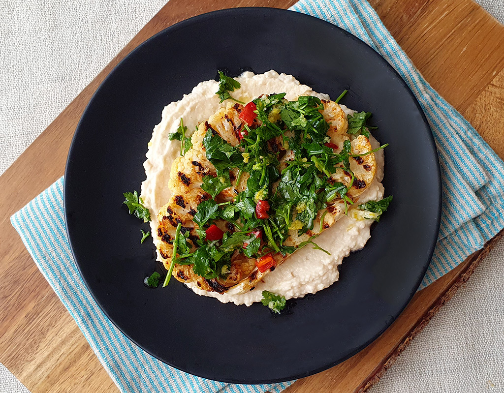 Cauliflower steak with bean hummus and chili gremolata