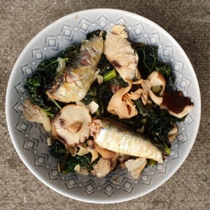 Sauteed mushroom and cabbage with sardines