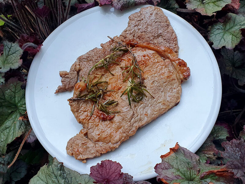 Grilled steak with rosemary and garlic