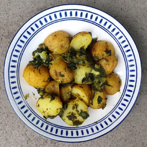 New potatoes with mustard and spinach