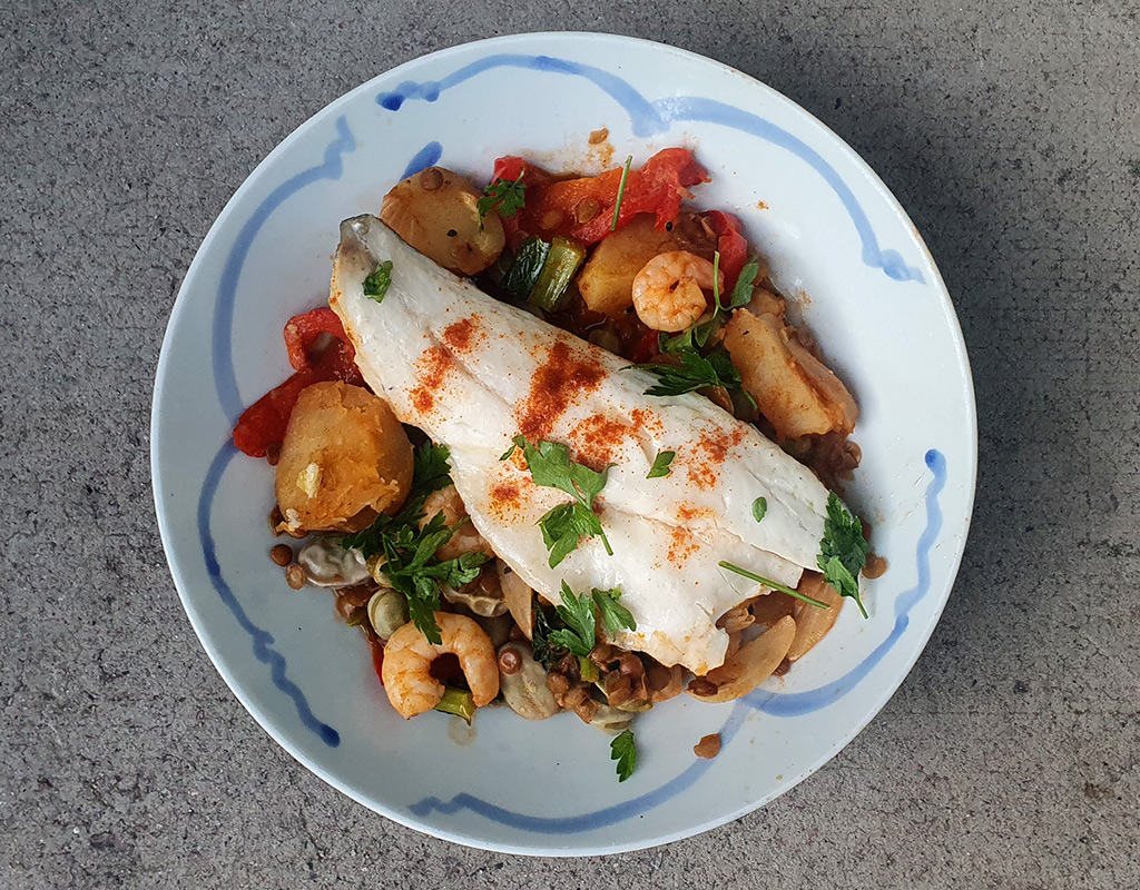 Vegetable stew with sea bass