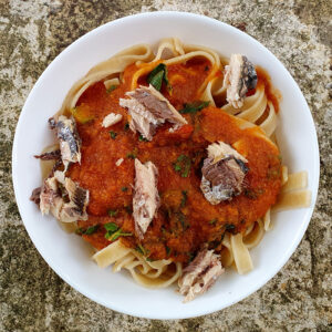 Pasta with sardines in rich tomato sauce