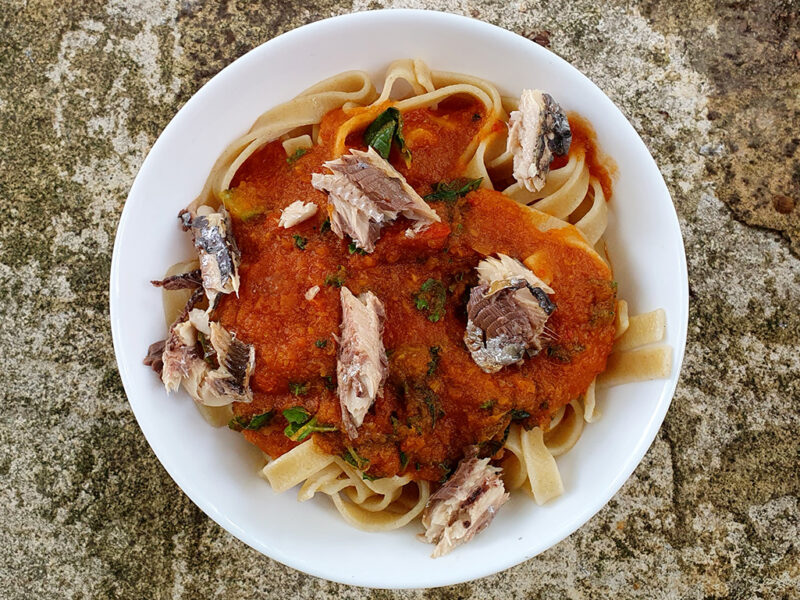 Pasta with sardines in rich tomato sauce