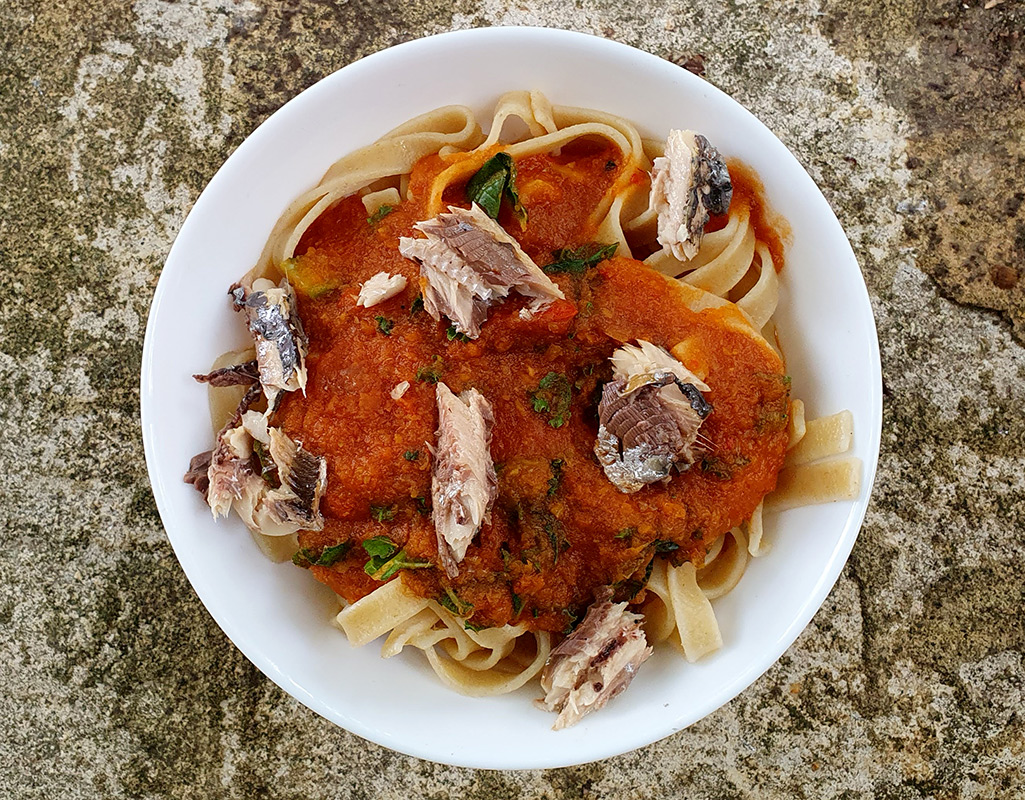 Pasta with sardines in rich tomato sauce
