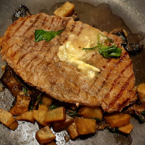 Steak with mushrooms and celeriac sauce